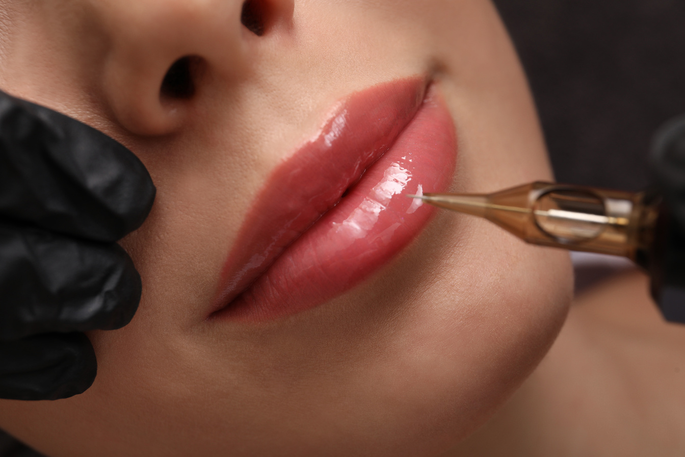 Young Woman Undergoing Procedure of Permanent Lip Makeup in Tatt